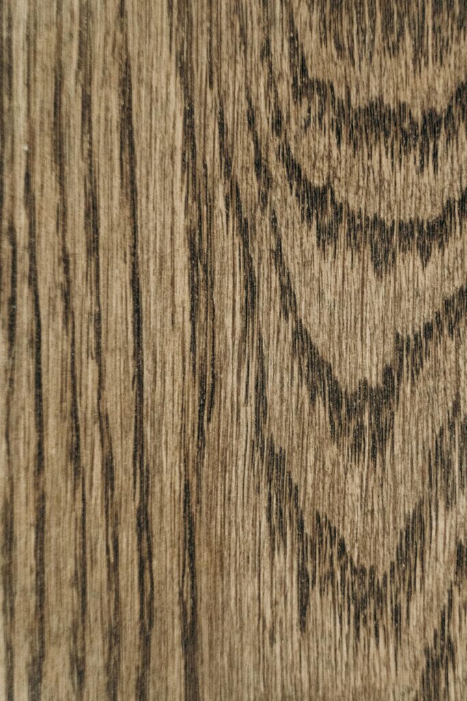 Detailed wooden plank texture showcasing natural wood grain and pattern, ideal for backgrounds.